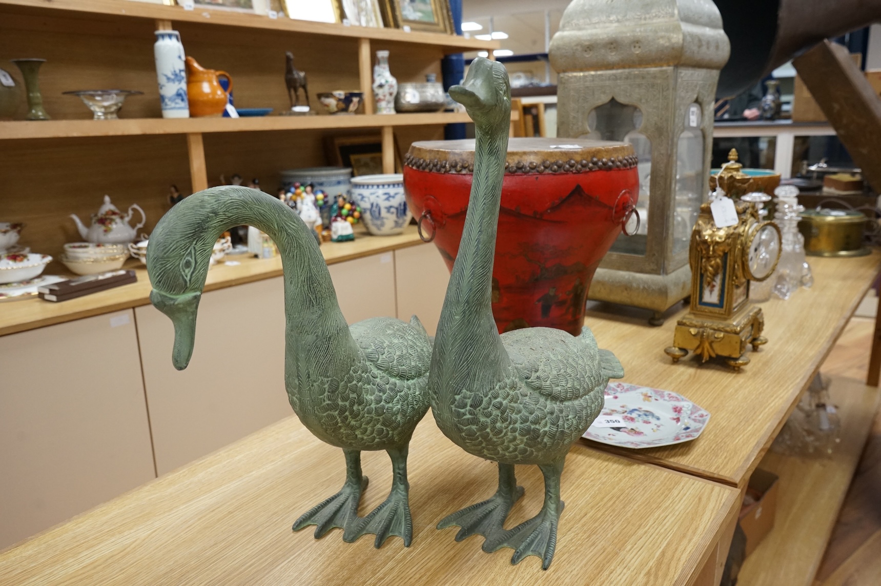 A pair of patinated spelter models of geese, 49cm